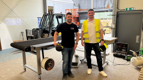 ESG Graphics Manager Luke Culpin and Soyang Europe Sales Manager Damien Martin with the newly installed Solent Texsew Conveyorline