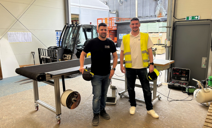 ESG Graphics Manager Luke Culpin and Soyang Europe Sales Manager Damien Martin with the newly installed Solent Texsew Conveyorline