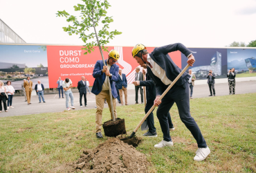 Planting a tree to commemorate the groundbreaking